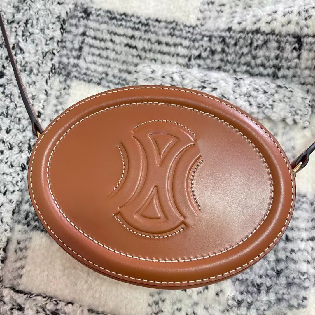 

Luxurys Designers TRIOMPHES mini Evening bags city cosmetic fashion round Oval Wallet Genuine Leather women's men handbags Crossbody clutch shoulder bags purse, White