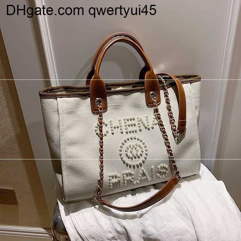 

qwertyui45 Totes Women's Fashion Designer's New Luxury Canvas Luxury Messenger Large Volume One Shoulder Tote Bags Handbags Women G220601 021723H, Black