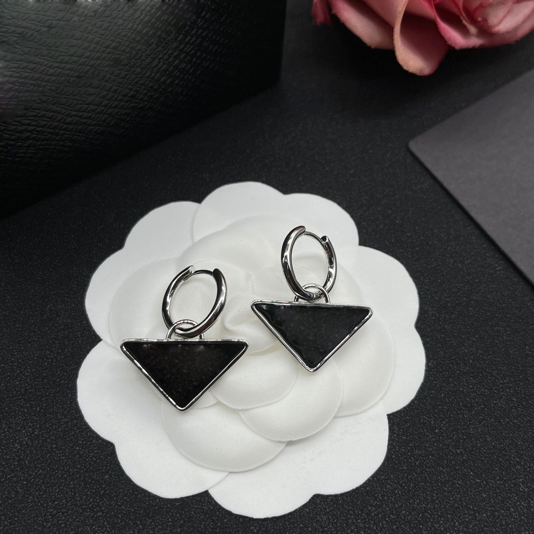 

Fashion new women's stud earrings inverted triangle brass earrings female designer temperament European and American street trend hip-hop earrings