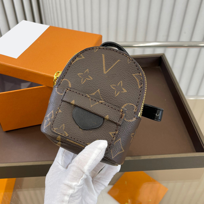 

Womens Designer Old Flower Wristlet Coin Bag Classic Mini Backpack Accessory Pendant Tiny Purse With Zipper Ourdoor Sport Mini Clutch Pocket M36900 10X12CM With Box, Brown