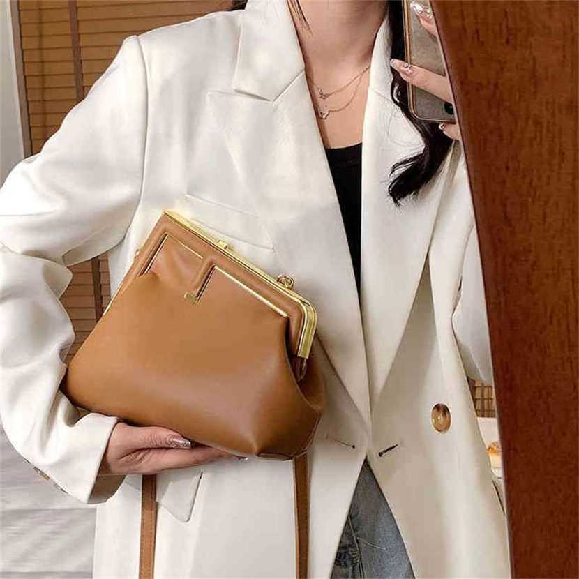 

Handbag High quality 2023 new bag spring trend personalized simple irregular Shoulder Messenger metal buckle women's bagL6WV, White13