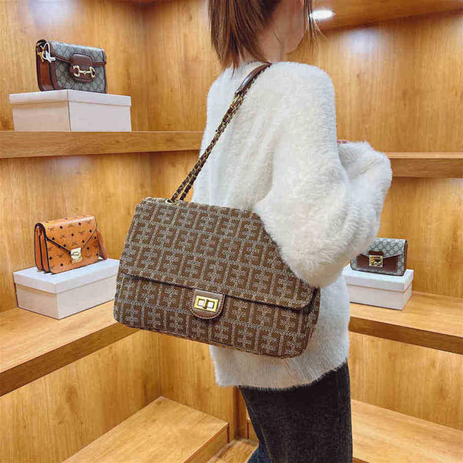 

2023 New Luxury High Quality Fashion Bag foreign underarm style single oblique span chain strip high-capacity tote womenHigh, Dark brown