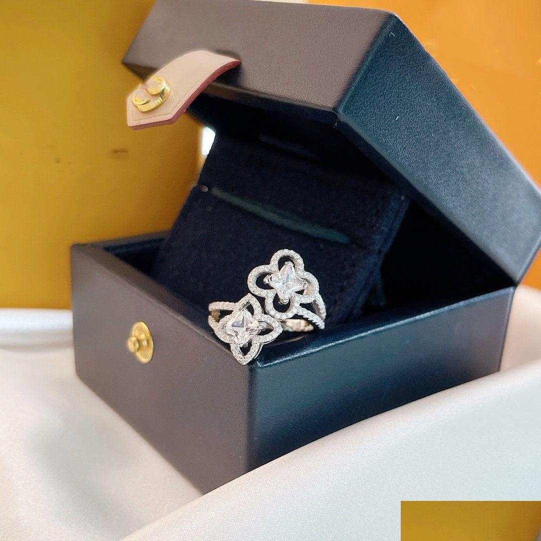 

Cluster Rings Luxury Esigner Ring Les Ardentes Top Sterling Sier Crystal Four Leaf Clover Double Flower Charm Open With Box For Wome Dh0Zw