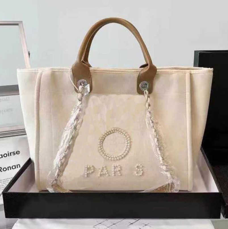 

CH Luxury Women's Beach Bag Brand Hand Bags Embroidered Handbag Female Pearl Big Shopping Small Backpacks Designers Canvas Chain Backpack Evening Handbags Eb8g