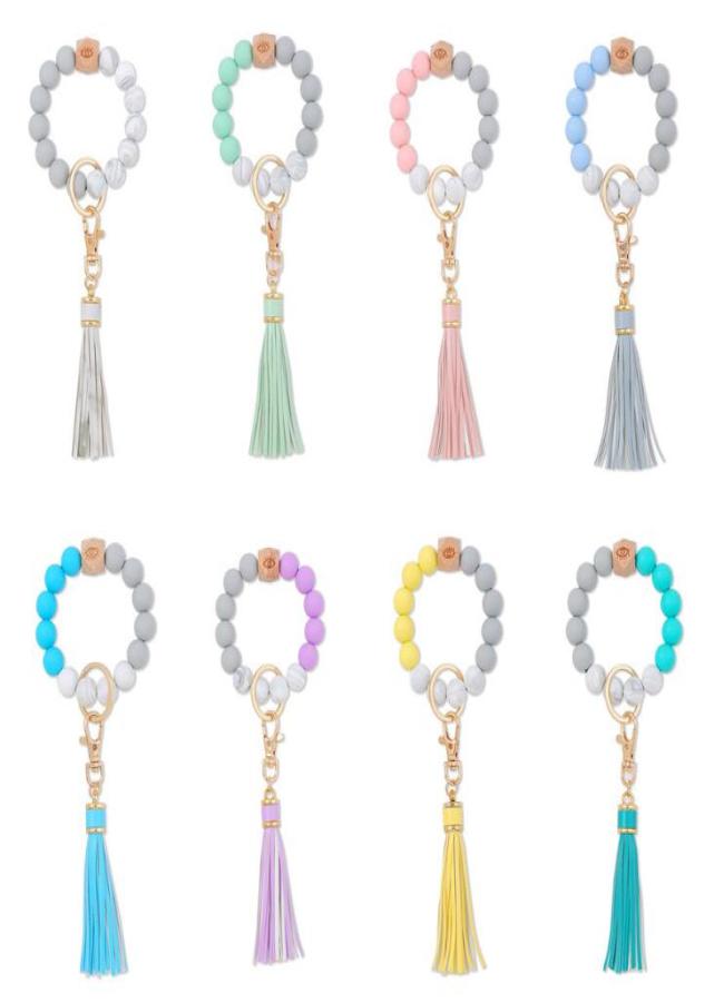 

8 Colors Silicone Bead Bracelet Keychain Female Bracelets Key Ring Tassel Wooden Beads Food Grade Girl Keyring Wrist Strap2684966