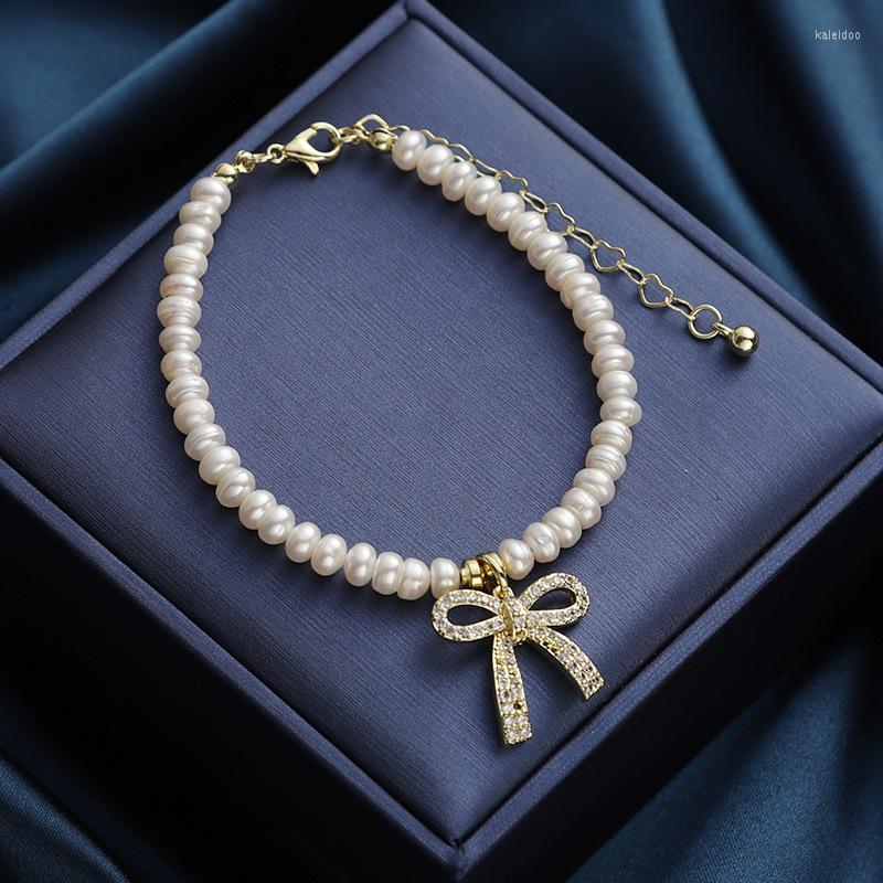 

Charm Bracelets Retro Temperament Natural Freshwater Pearl Bracelet Micro-inlaid Zircon Bowknot Pendant Korean Simple Cold Wind
