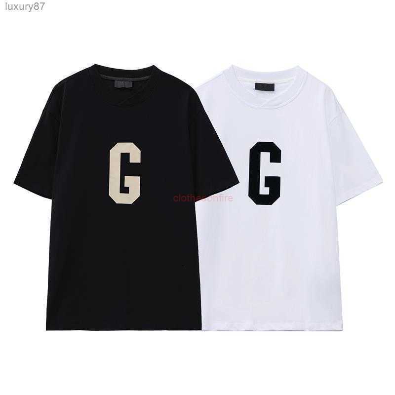 

Ess Tees T-shirts Luxury Designer Fashion Clothing Season 7 g Letter Flocking Mens Womens Loose Couples Summer High Street Fog Short Sleeve, White