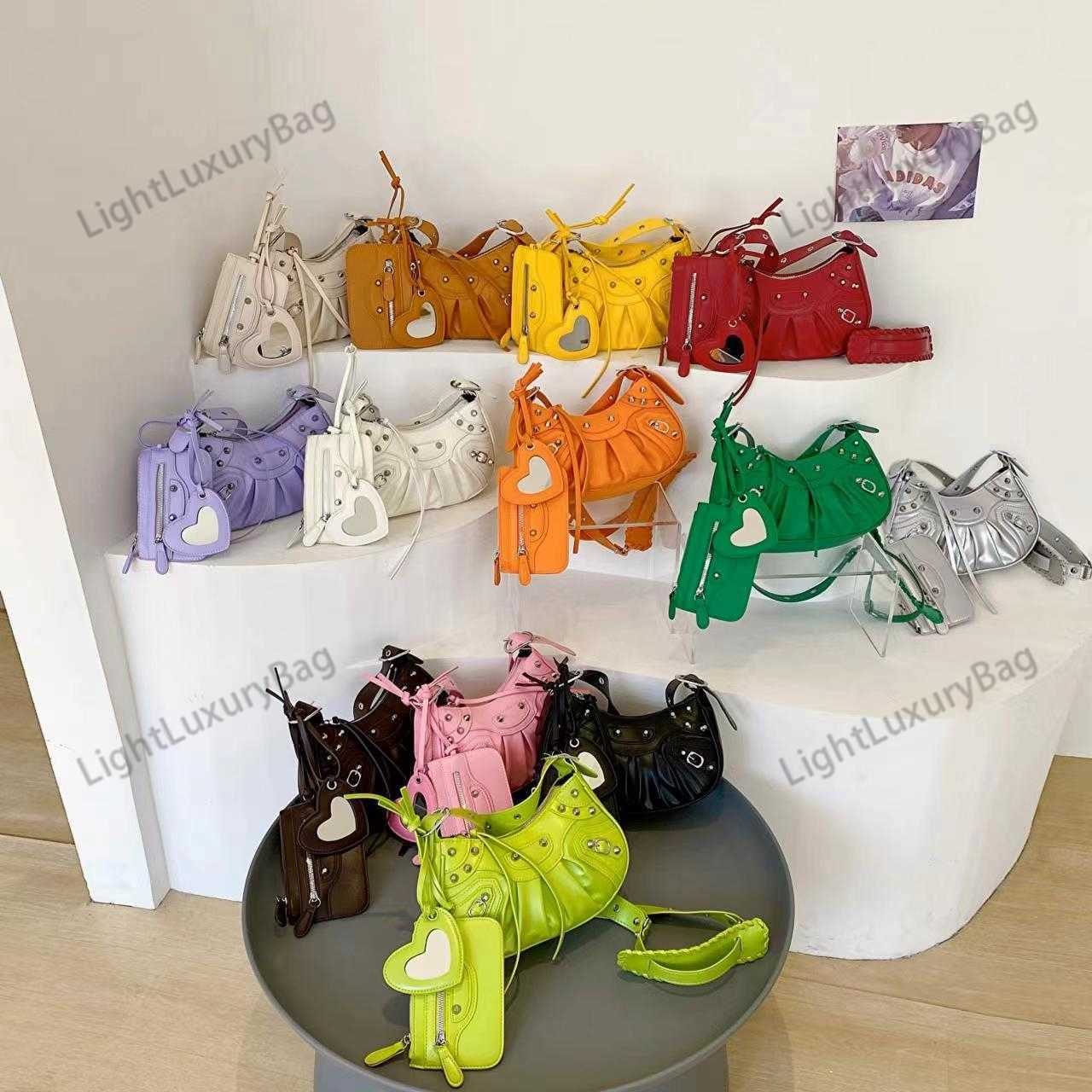 

Designer Le Cagole Mini Metallic Leather Shoulder Bag Luxury Brand Underarm Bag Female Wrinkled Crescent Single Shoulder Bag Female Rivet Motorcycle Bag