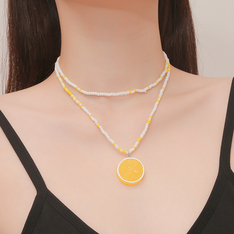 

Fashion retro niche design yellow and white beaded necklace in Europe and America simple temperament sweet and fresh lemon pendant bracelet