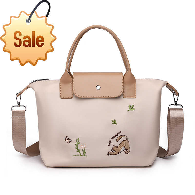 

Women's Designer Bags Longxiang Bag Embroidered Dumplings Tote 2023 New Flip Handbag Commuters Versatile Canvas One Shoulder Crossbody Factory Direct Sales, Black11