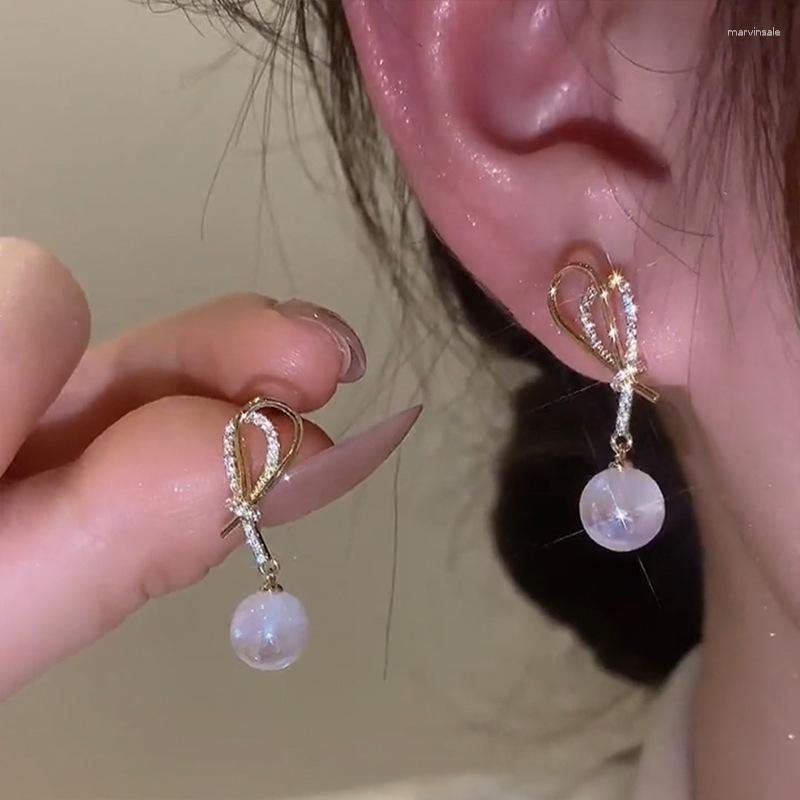 

Stud Earrings South Korea Luxury Mermaid Ji Pearl Bow Tie Design Temperament Simple Premium Earrings.
