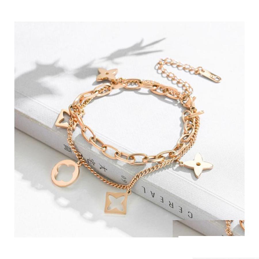 

Charm Bracelets Cool Double Layered Hollowed Stainless Steel Clover Bracelet Lucky Four Leaf Jewelry Drop Delivery Otyj4 Dhbkp
