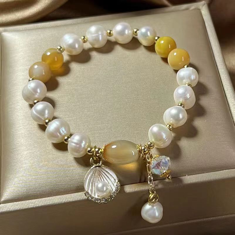 

Step by step Natural Hotan Jade Belt Bell Bracelet Female Super Immortal Small Group Light Luxury Twin Friend Bracelet