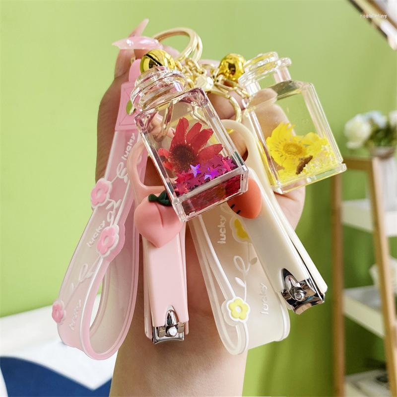 

Keychains Transparent Acrylic Dried Flower Perfume Bottle Keychain Floating Liquid Quicksand Keyrings For Women Bag Pendant Gift