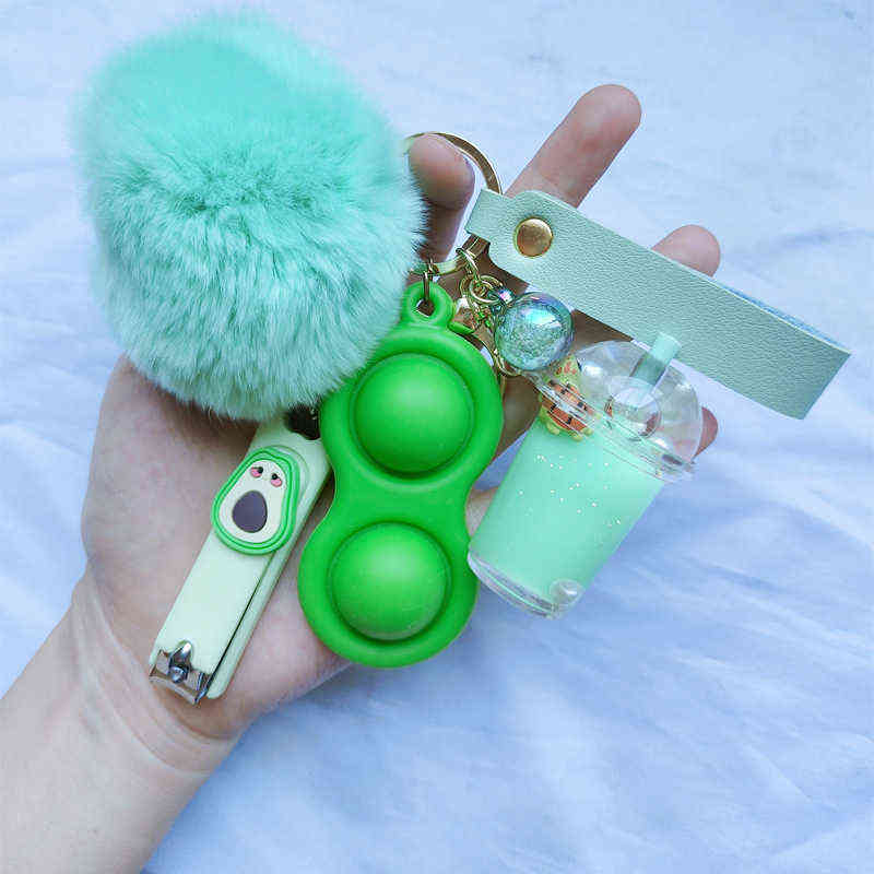 

Keychains INS Hot Selling Liquid Keychain Luxury Boba Turtle Comfort Keychain Nail Clippers Pom Ball Keyring Milk Tea Liquid Keychain T220909