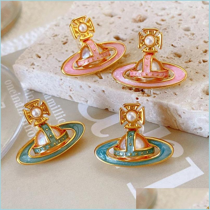 

Stud Pearl Inlaid Three-Nsional Saturn Enamel Glaze Planet Earrings Stud Western Queen Star Aura Starry Sky Designer Jewelr Dayupshop Dhpfu