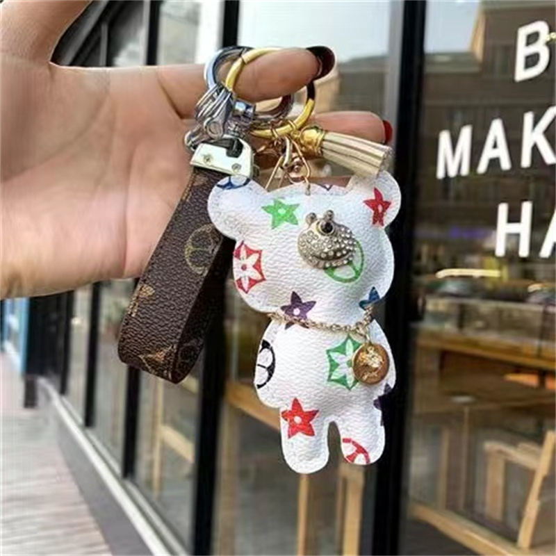 

Fashion Keychain Luxury Designer Stylish Sun-flower Doll Pendant Keychains Three Colors Keys Buckle Mens Womens Keys Ornaments High Quality