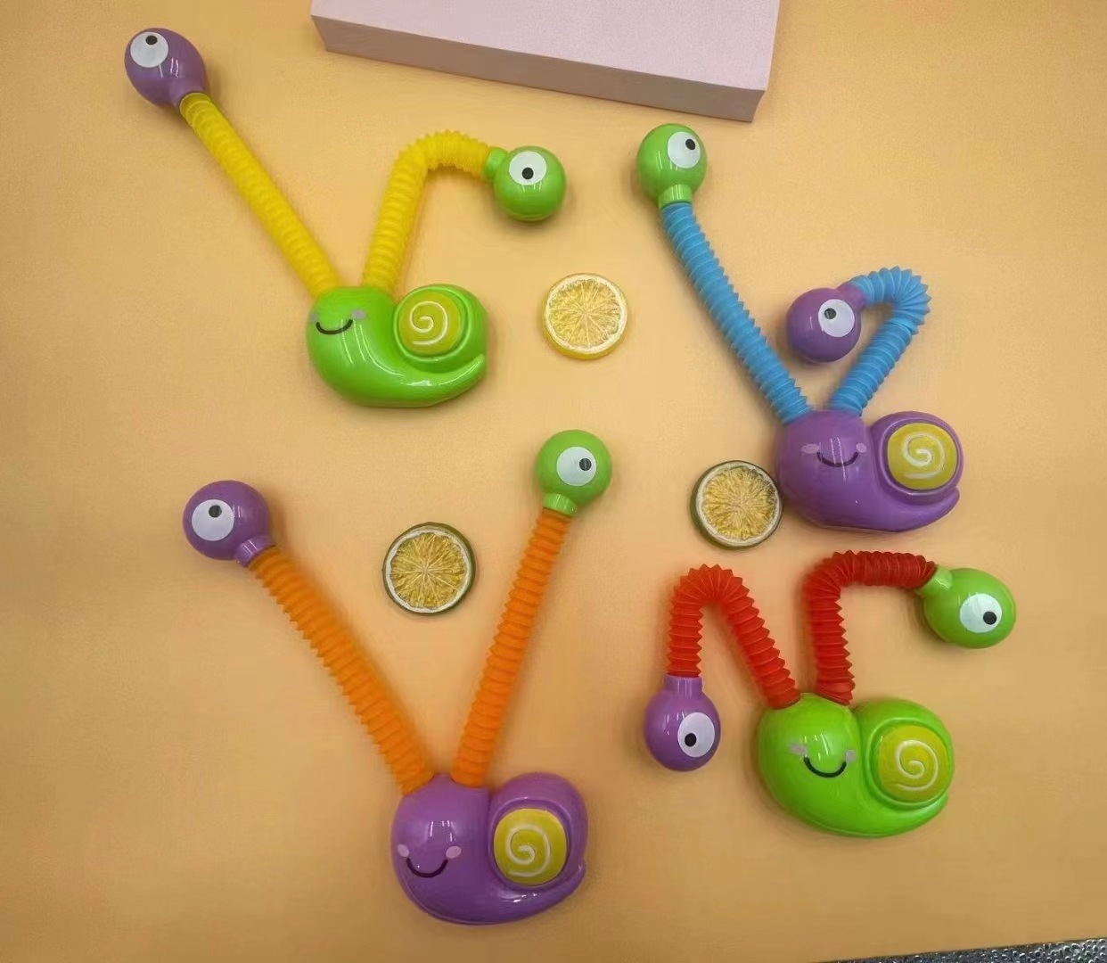 

UPS cartoon luminous decompression toy telescopic tube snail puzzle DIY toy versatile shape stretching pendulum