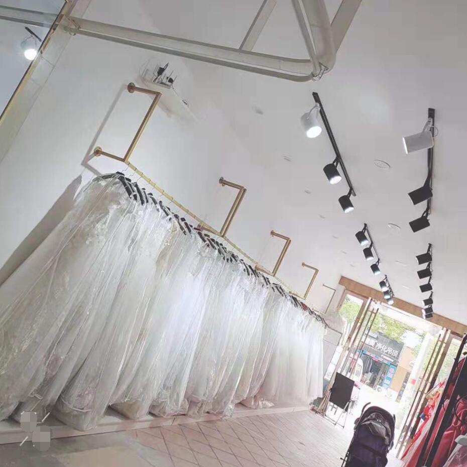 

Wedding shop display shelf Commercial Furniture Gold simple wall hung clothing store wall mounted dress rack Qipao studio show shelfs