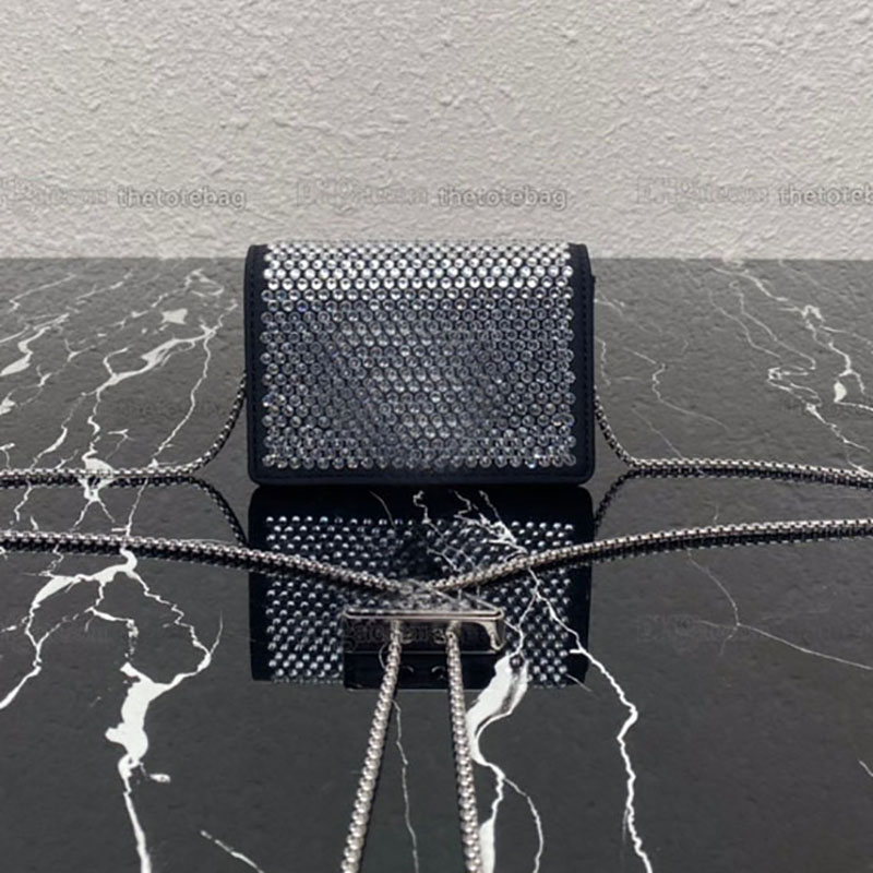 

Crystal-studded card holder with shoulder strap Enameled metal triangle logo Moire and leather lining Removable chain strap, Customize