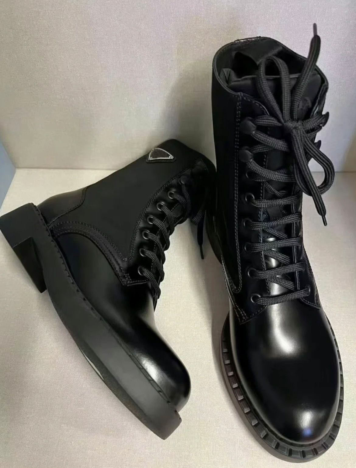 

Winter Fashion Brands Brushed Leather Re-Nylon Ankle Boots Black Recycled Enameled Metal Triangle Combat Boot Chunky Lug Sole Platform Motorcycle Booties