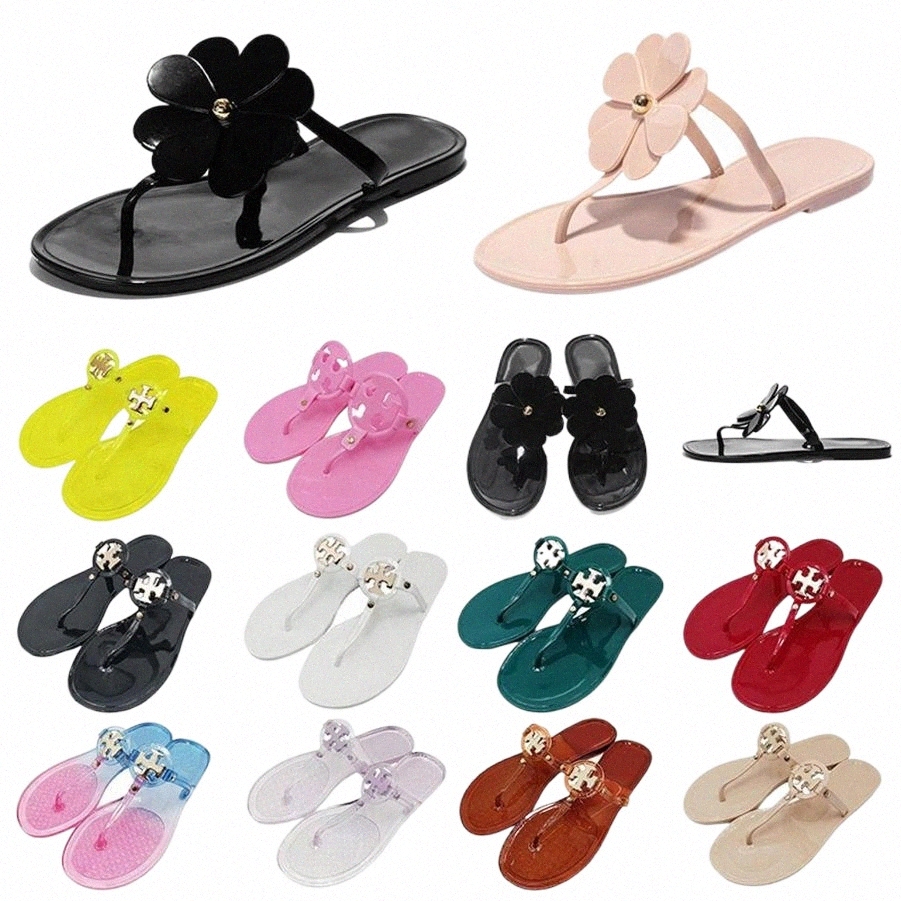 Sandales de créateurs pour les femmes dames creusées motif appartements à talons bas pantoufles de mode Tories luxueuses glisses en caoutchouc Su