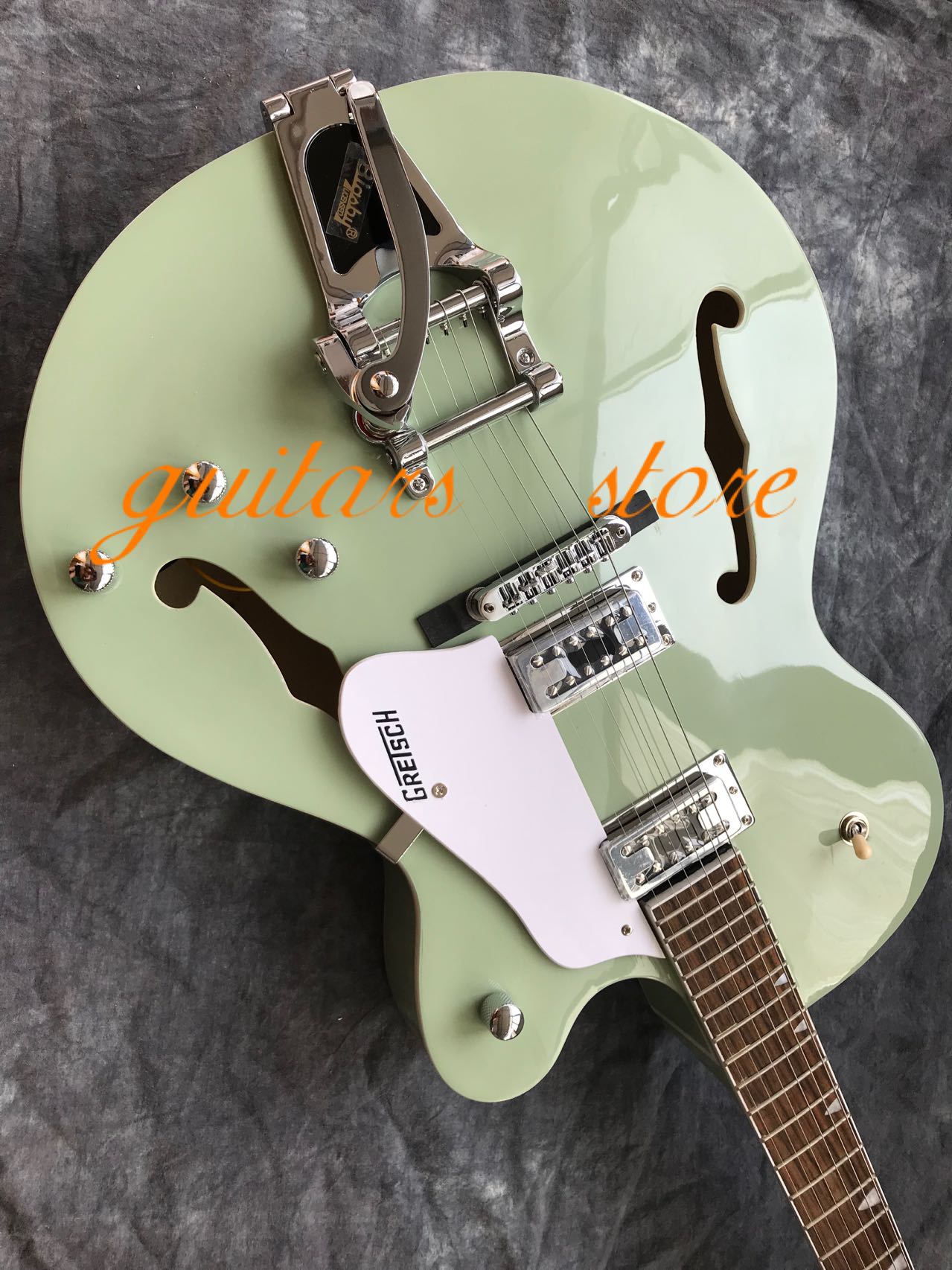 

Light Green Semi-Hollow Jazz Electric Guitar Maple Body F Hole Tremolo Can Customize
