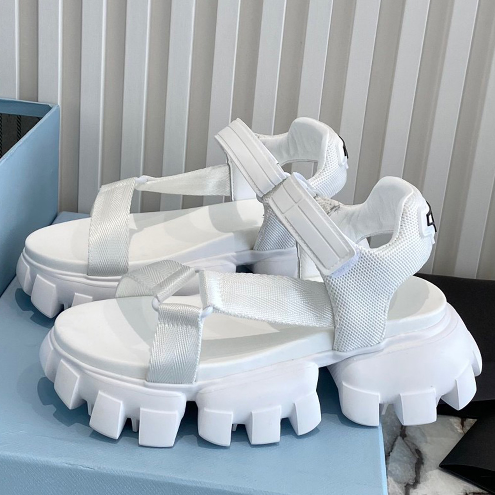 

Sporty woven nylon tape sandals A new version of these hiking world inspired sandals features chunky rubber tread sole with contrasting brand logo on the buckle strap, Shipping supplement