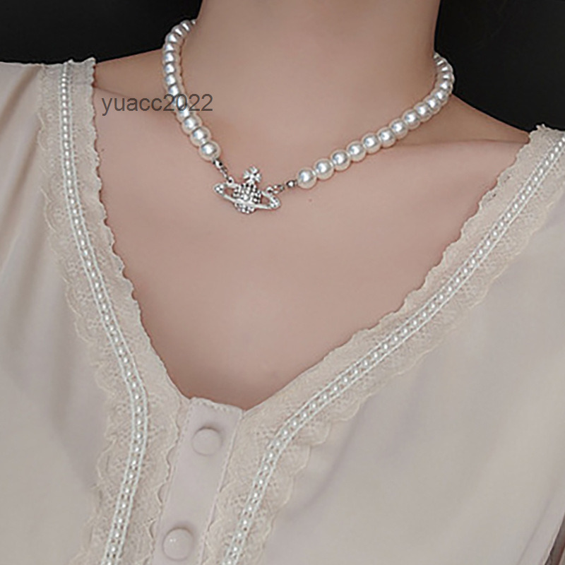 

Pendant Necklaces Vivian Westwood set with diamonds popular Star Pendant net red collarbone chain female simple ins style Saturn Pearl Necklace