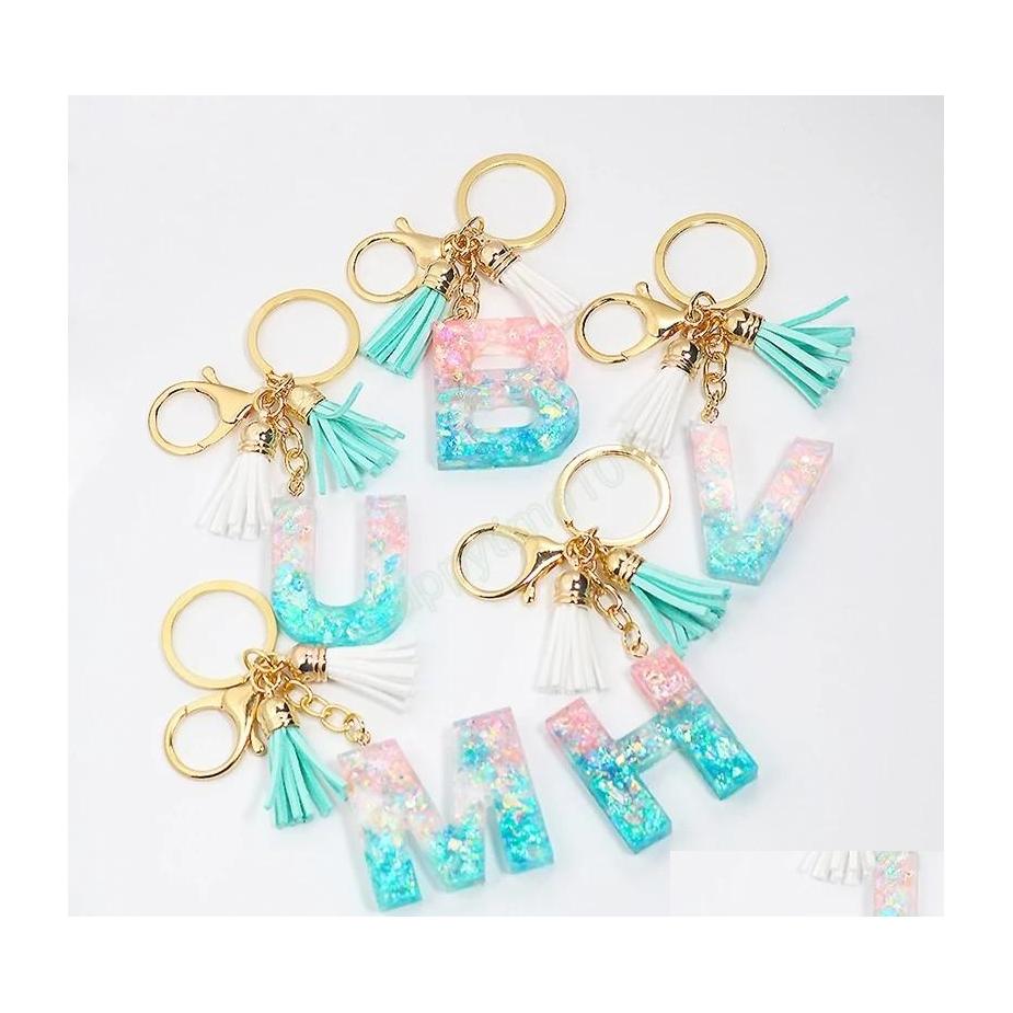 

Key Rings Women Fashion Blue Pink Letter Keychains Sequins Filling Resin Key Chain With Double Tassel Bag Hanging Pendant Keyrings G Dhhdf