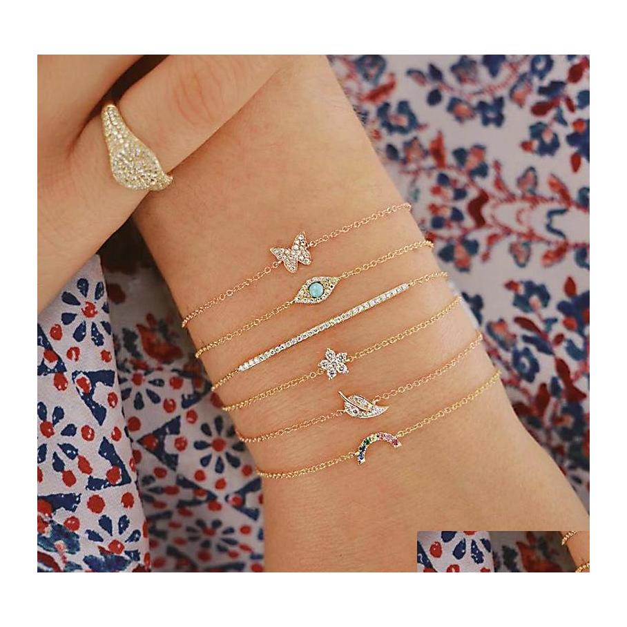 

Charm Bracelets Fashion Jewelry Mtilayer Bracelet Set Rhinestone Butterfly Leaf Flower Blue Eye Thin Chain Bracelets 6Pcs/Set Drop De Dhx4T