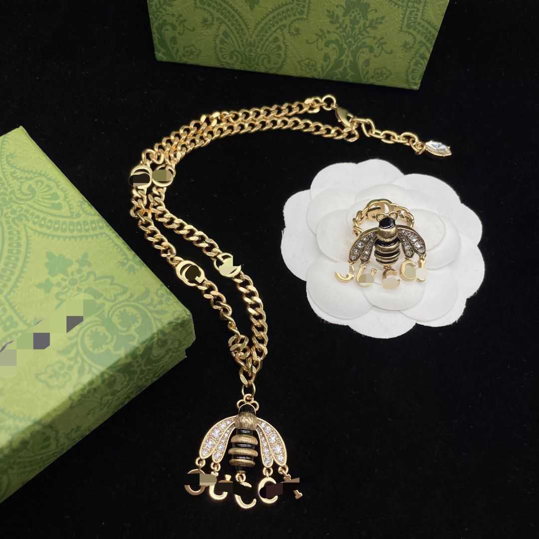 

Gucy necklace silver designer necklaces Ancient New Bee Letter Tassel Necklace Ring Set Brass Material Does Not Fade Middle Light Luxury