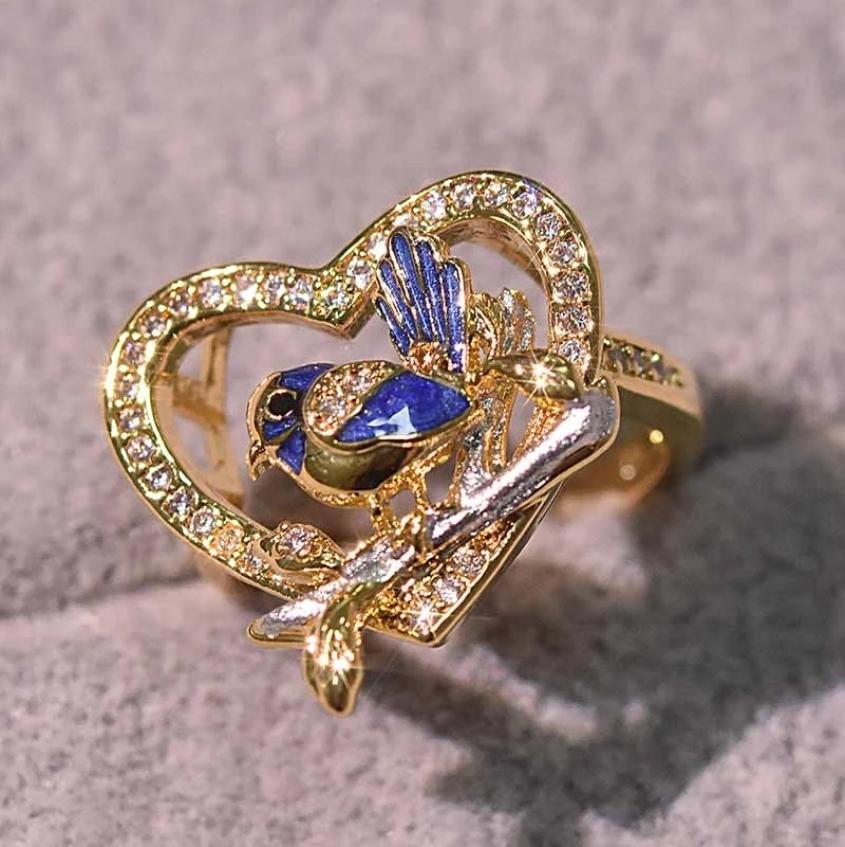 

New creative blue bird sparrow Wren ring European and American goldplated glue dropping diamond14k gold ring shine in the dark8369143
