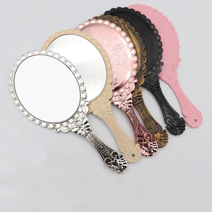 

Makeup Mirrors Ladies Vintage Repousse Oval Floral Hand Held Dresser Romantic Lace Hand-held Mirror Bronze Silver Gold Pink Cosmetic Tool Beauty Salon BC223