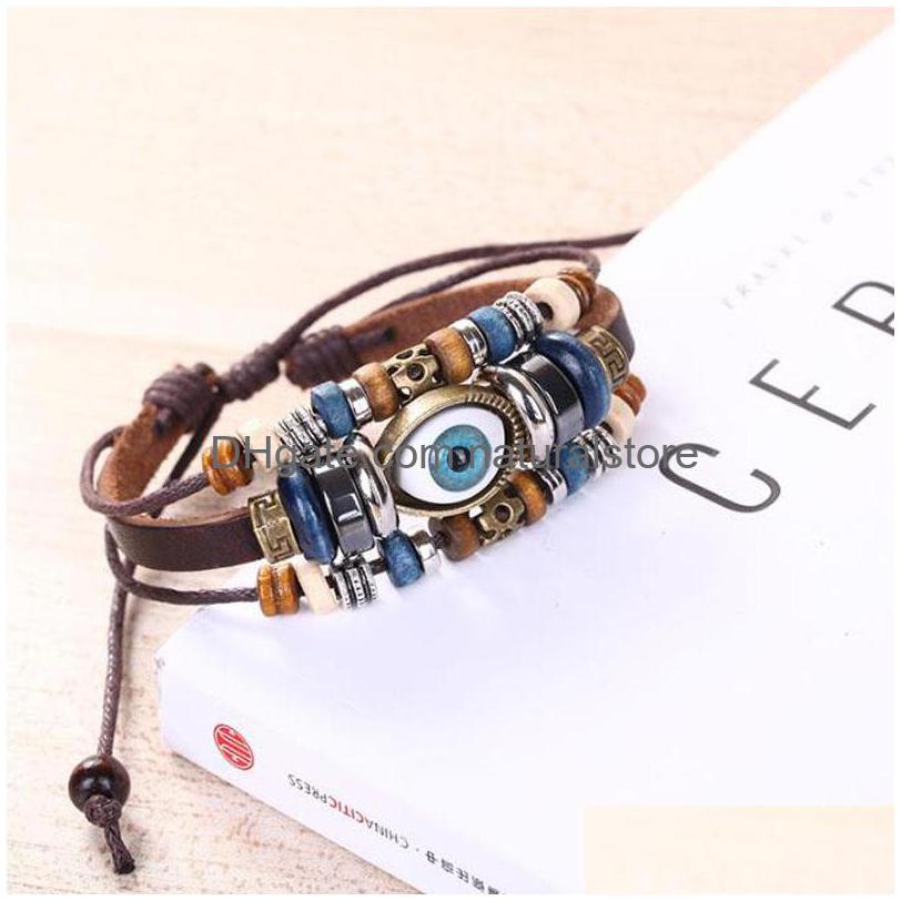 

Charm Bracelets Wholesaleethnic Punk Style Angel Devil Eyes Cuff Men Leather Mtilayer Braided Bracelet Drop Delivery Jewelry Dhqug
