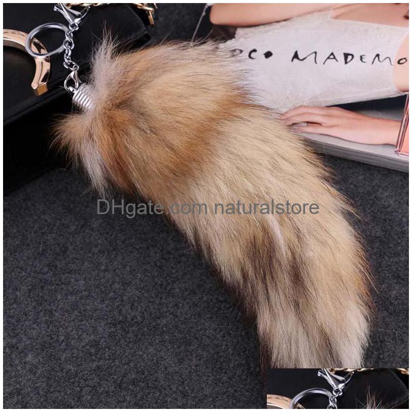 

Keychains Lanyards Big Size Fluffy Sunny Tail Fur Cosplay Toy Handbag Accessories Key Chain Ring Hook Tassels Black Brown Christma Dhzzp