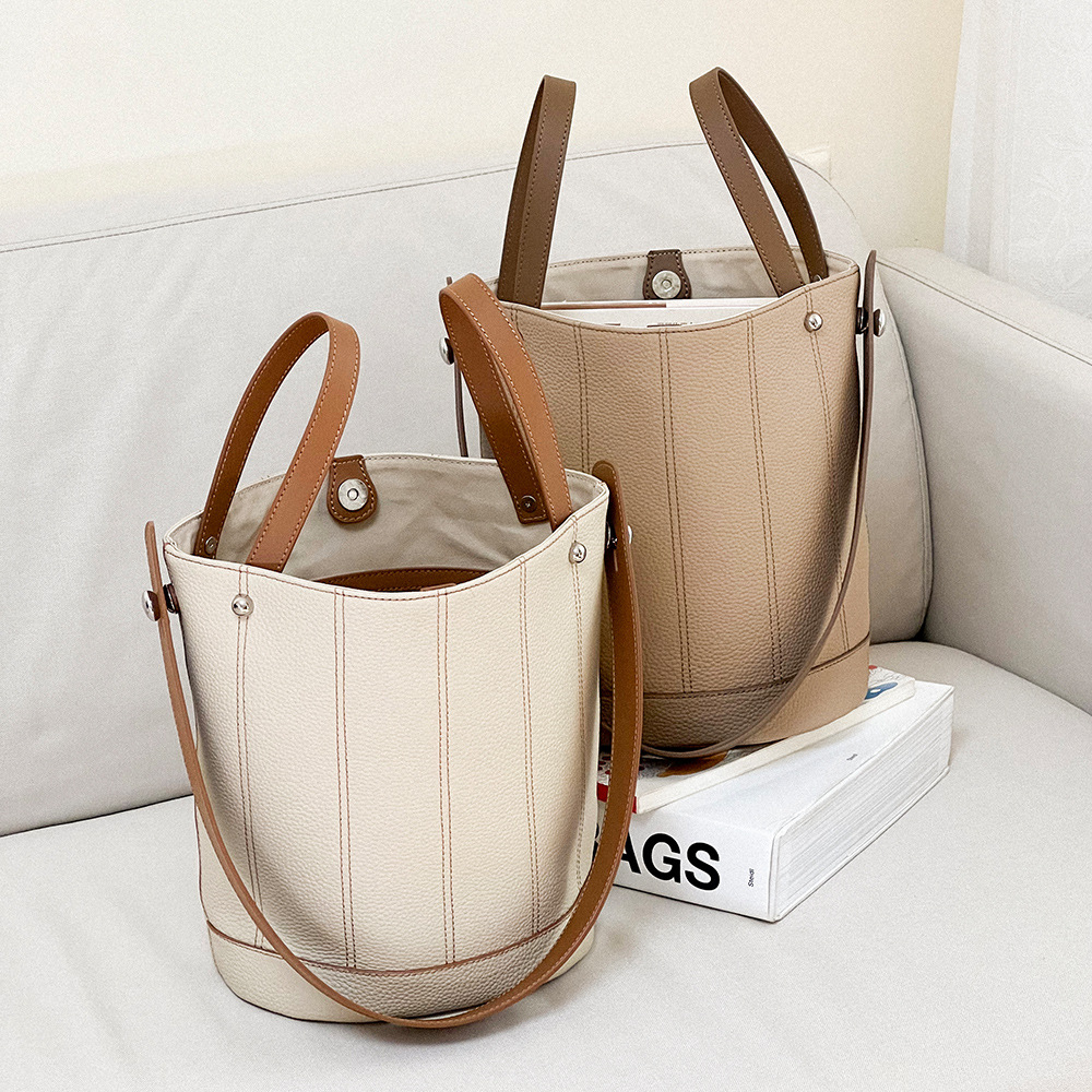 

New hand bill shoulder bags fashion bucket bao head layer cowhide simple color contrast large capacity basket bag 21cm, Milk tea grey