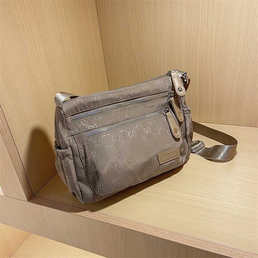

Luxury Designer Bag women's New Oxford waterproof versatile canvas bag light leisure One Shoulder Messenger, Khaki