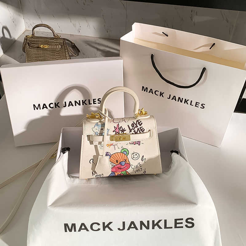 

Handheld Herme Designer Bags Hong Kong Mack Jankles Leather Graffiti Mini Female Summer 2022 New Fashion Portable Crossbody, Not for sale do not shoot