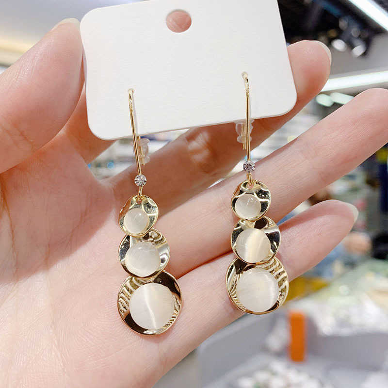 

Dongdamen small gourd dumb gold cat's eye stone earrings South Korea