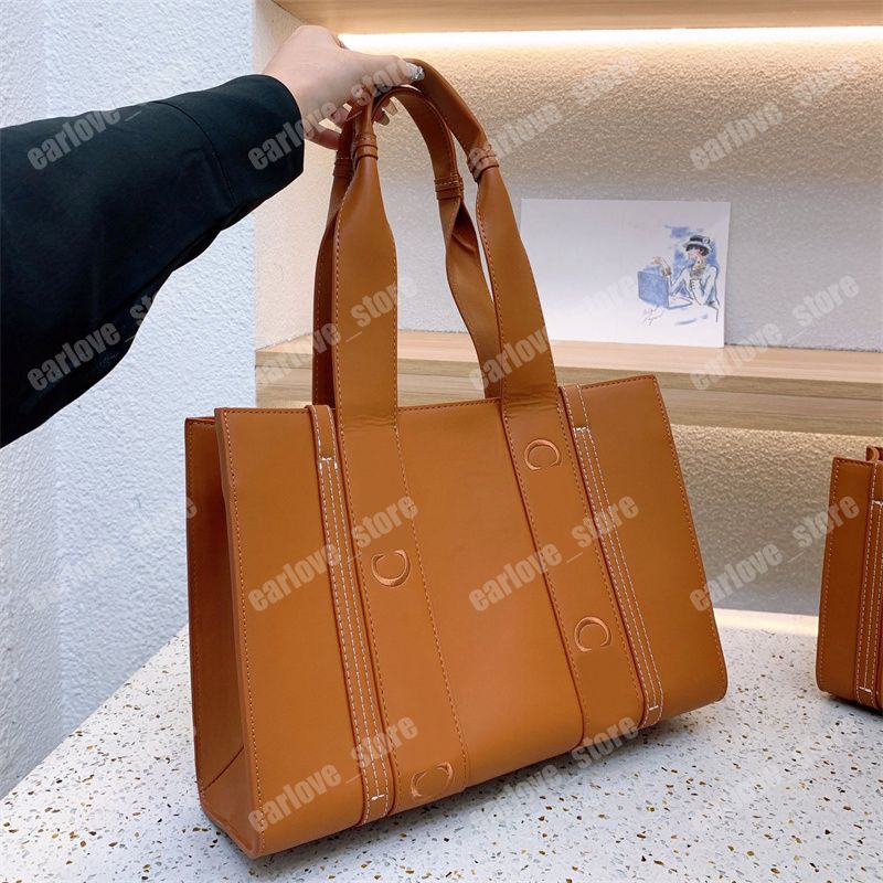

Autumn Womens Shopping Bag Designer Woody Tote Bag Fashion Leather Handbags Luxury Crossbody Totes Black Brown Shoulder Bags 2 Size