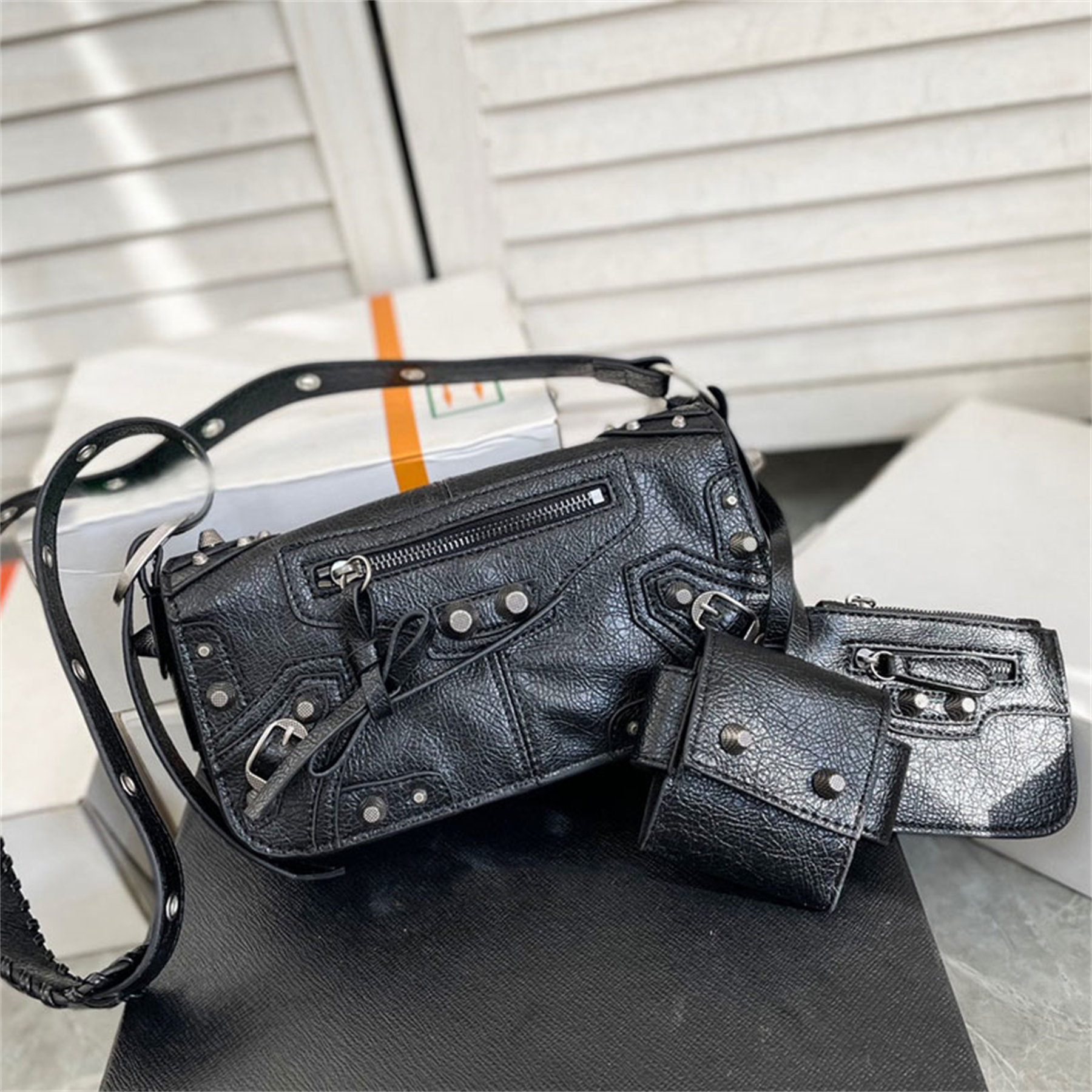 

Le Cagole Men XS Flap Bag in black Arena lambskin aged-silver hardware Shoulder Bags Leather braided shoulder pad Crossbody Luxury Designer removable zipped pouch 23