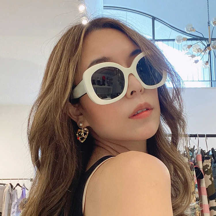 

Sunglasses Hepburn style panda 2022 new big frame white oval net red same Tiktok concave shape sunglasses