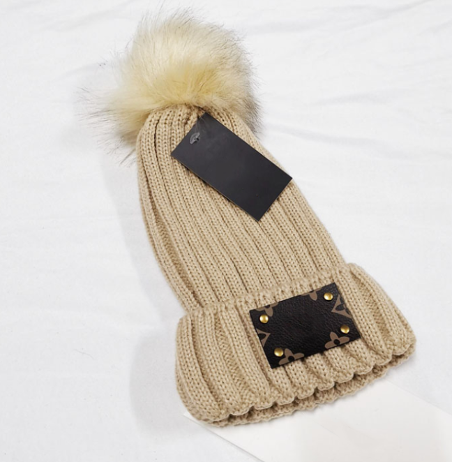 

Designer Woolen hat Female Knitted Hats Fur Ball Korean Warm Female All-Match Earflaps Toque