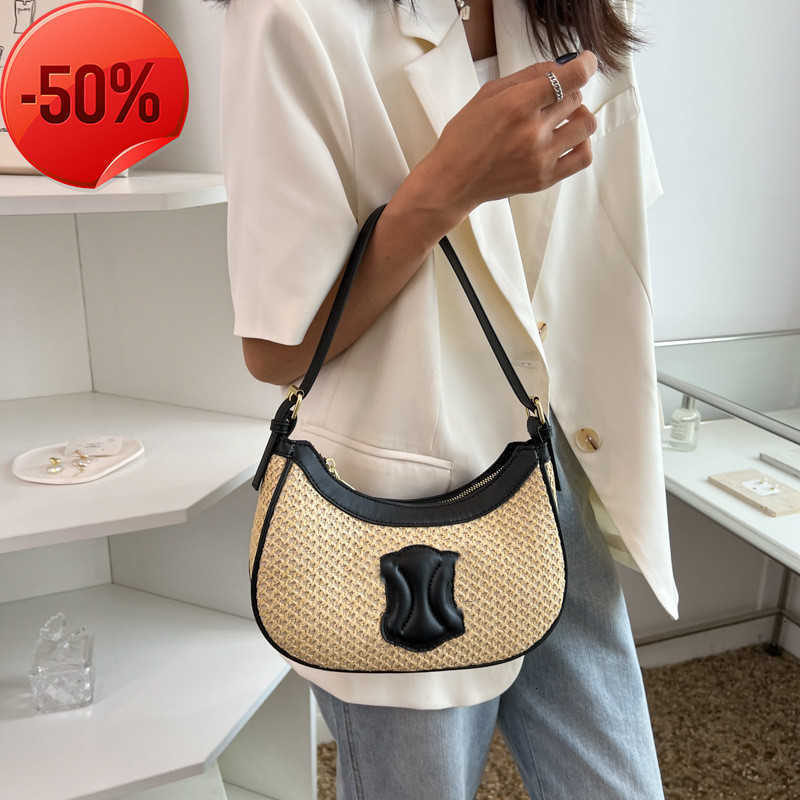 Sacs de créateurs Arc de triomphe Nouvelle paille d'été tissu les aisselles féminines épissant la main de style étranger épaule de style étranger