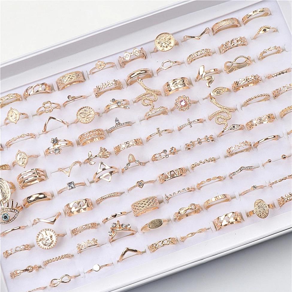 

Fashion 100pcs lot Stars Crown Love Animal Gold Plated Finger Rings For Women Mix Style Wedding Jewelry Party Gifts173e
