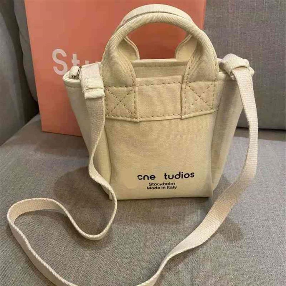 

Acne Canvas Tote Bag 2022 european American New White Women's Bagcanvas Portable Messenger Bag Large Capacity Tote Bag Letter216E, White trumpet