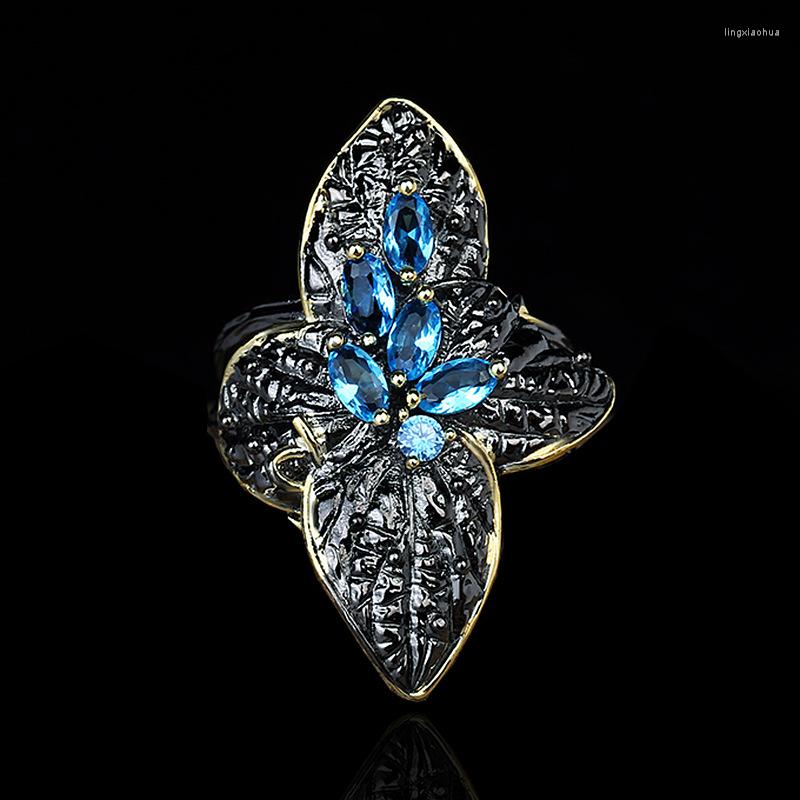 

Cluster Rings Unique Retro Ethnic Style Black Gold Two-color Leaf Flower Ring Blue Zircon Creative 925 Silver Women's Jewelry