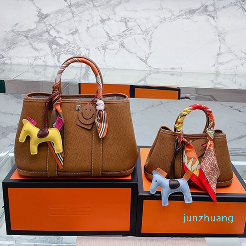 

2022 Totes Women Soft Cowhide Handbags Purse Leather Shoulder Bag Cross Body Bags Removable Strap Ribbons Pony Decoration Interior Zipper Pocket 2 sizes, 10