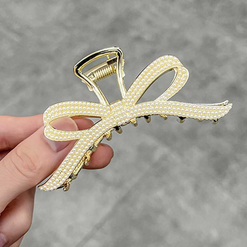 

Korean temperament pearl bow clip large net red fashion back head shark clip high sense elegant hairpin